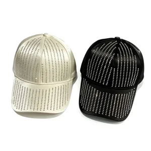 Close-up view of satin baseball cap featuring delicate rhinestone details and smooth texture.