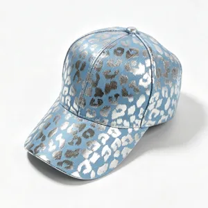 Blue denim baseball cap with metallic silver leopard print texture detail showing quality craftsmanship.