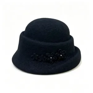 Black wool cloche hat detail showing floral and rhinestone decoration for winter.
