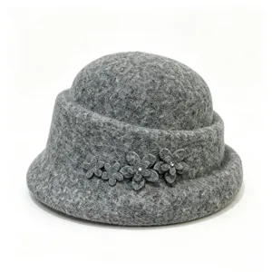 Detail shot of gray wool felt cloche hat with elegant floral rhinestone embellishment.