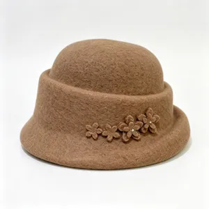 Detailed close-up of a elegant brown wool felt cloche hat featuring cute flower appliques.
