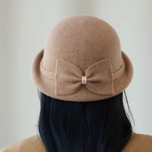 Retro wool blend bucket hat for women with elegant bow detail, stylish autumn winter headwear.