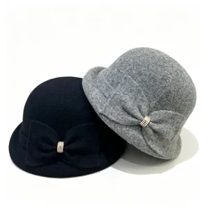 Detailed view of the French retro wool blend bucket hat with elegant bowknot and rhinestone.