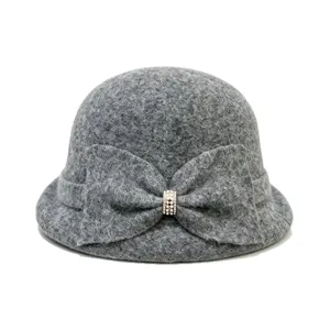 Grey wool blend cloche hat with bow and rhinestone, vintage winter fashion for women.