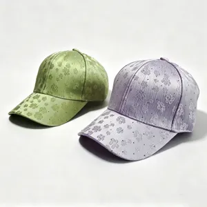 Fashion rhinestone women's baseball cap, stylish embroidered clover hat for casual wear.