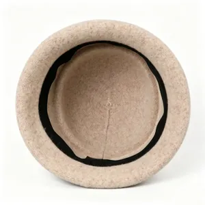 Interior detail view of a warm wool felt bucket hat, soft fabric lining, minimalist design.
