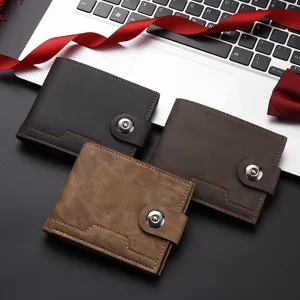 Detailed shot of men short leather wallets in black and brown with snap closure button design.