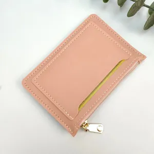 Detail view of the ultra-thin pink women coin card wallet with zipper and card slot.