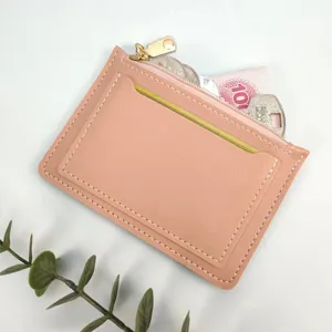 Ultra-thin pink leather women coin purse card holder with zipper pocket and compact design.