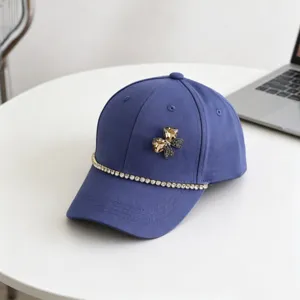 Kids blue baseball cap with sparkling crystal rhinestone bow and chain decoration for summer.