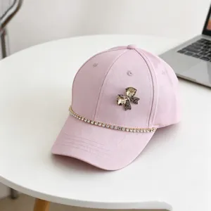 Rhinestone chain bow pink baseball cap detail view, cute fashion casual sun hat accessory.