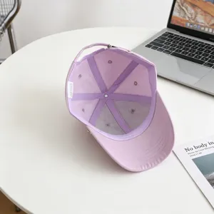 Closeup detail view of the purple baseball cap interior, showing mesh lining and neat stitching.