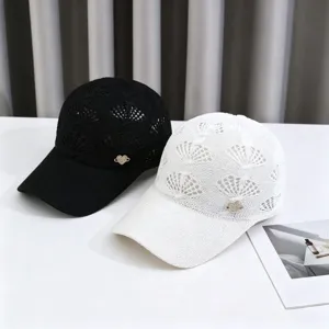 Detail view of hollow knit breathable baseball caps with rhinestone heart logo, sun protection.