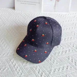 Detailed view of women waffle mesh baseball cap featuring cute red cherry decor and white dots summer.