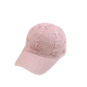 Pink knitted baseball cap with hollow-out pattern and rhinestone heart charm for women outdoor.