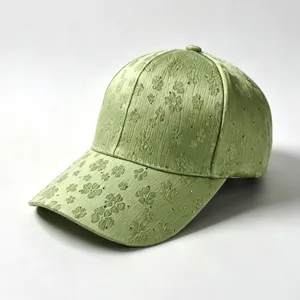 Detailed view of the green rhinestone embroidered clover baseball cap texture and surface.