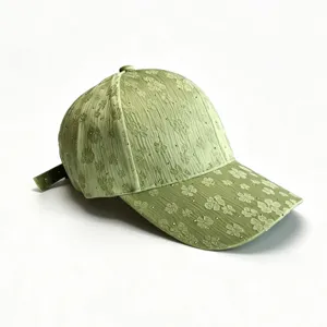 Green rhinestone baseball cap with clover pattern, stylish women's sun hat for spring.