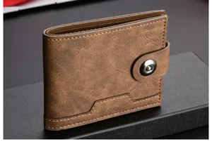 Men's brown soft leather short wallet detail view with card slots and snap button closure.