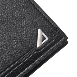 Close-up of black leather men wallet detail with metallic triangle logo design texture.