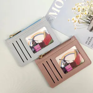 Slim women's coin card holder wallet with zipper pocket and clear ID window for daily use.