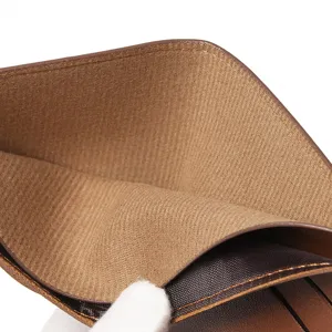 Close-up detail shot of men's short wallet interior, brown leather lining, exquisite craft.