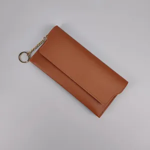 Brown long wallet for women with golden chain clasp, sleek solid design for daily use.