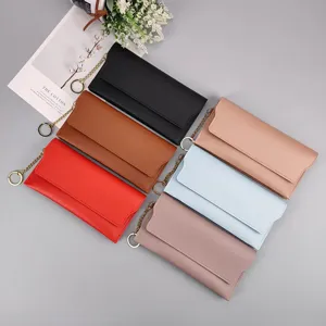 Women long wallet solid color snap closure stylish clutch purse with metal chain strap.