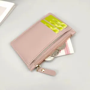 Detailed view of pink PU leather card holder wallet with zipper coin pocket and multiple slots.