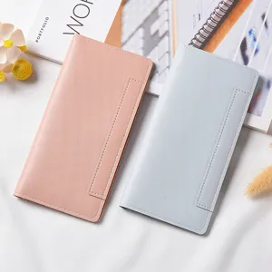 Minimalist women long wallet slim snap button multi-card slot color-block design detail view.