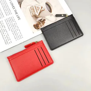 Detail view of compact PU leather zippered card holder with multi slots in black and red colors.