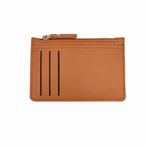 Minimalist brown leather zipper card holder with multiple slots and coin pocket main view.