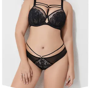 Detailed view of black plus size lace bra and panties set featuring chic multi-strap design.