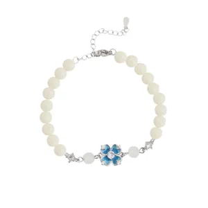 White beaded bracelet featuring a charming blue enamel four-leaf clover and sparkling crystal details.