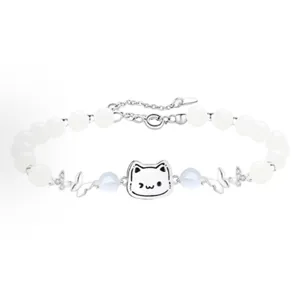 Exquisite silver bracelet featuring a cute cat charm, white beads, and sparkling butterfly details.