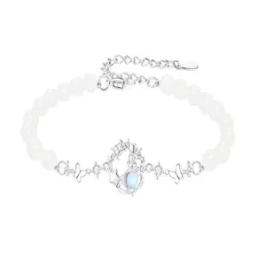 Silver-plated magical girl crescent moon bracelet with white beads and rhinestone details.