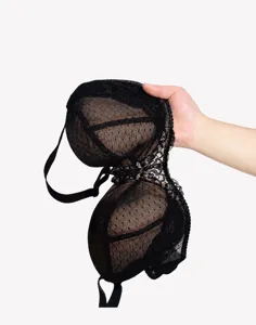 Close up detail of black plus size bra showing 3d molded cup structure and breathable mesh.