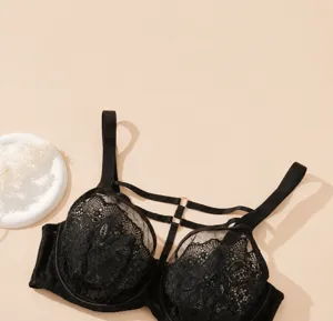 Detailed view of the black lace plus size bra featuring delicate mesh and dual strap design.