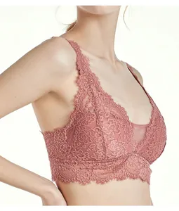 Detail view of women's pink lace wireless bralette, soft breathable fabric, sexy design.