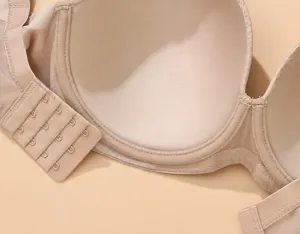 Bra cup detail close-up showing breathable fabric, smooth lining and adjustable multi-hook strap.