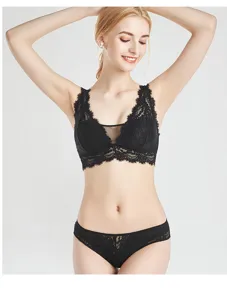 Close-up detail of the black lace bra and panty set, showcasing floral lace and wireless fit.