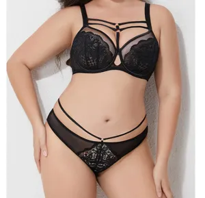 Detailed view of plus size black lace bra and thong lingerie set with strap design.