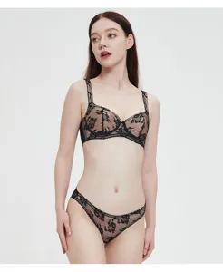Detailed showcase of the elegant black floral lace lingerie set featuring sheer mesh and soft support.
