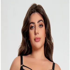 Close-up detail of plus-size black wireless bra with thin straps, soft fabric and comfortable fit.