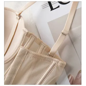Close-up detail of women's beige corset bra, mesh texture, adjustable straps, fishbone.