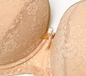 Detailed view of beige lace bra cup, featuring delicate floral embroidery and a cute bow.