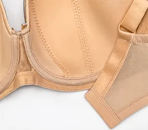 Plus size bra detail view showing breathable side wing, smooth fabric, and fine stitching.