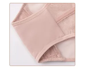 Detailed view of women's lace mesh underwear fabric, soft nude tone, exquisite craftsmanship.