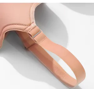 Close up detail of comfortable women bra adjustable strap in nude pink soft fabric.