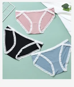Women cotton mid-waist briefs detail view featuring delicate lace trim in three colors.