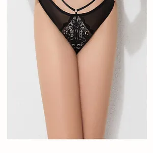 Close-up of black sexy lace women panties, mesh breathable design with straps detail.